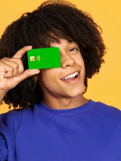 A happy guy with his Chime Credit Builder Secured Visa.