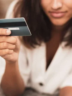 A woman using her Discover it Secured Credit Card.