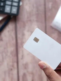 Someone holding the Mission Lane Visa Credit Card.