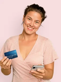 A woman holding her Discover it Cash Back Credit Card.