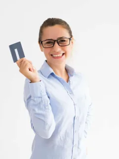 A woman holding her Discover it Cash Back.