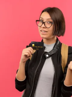 A girl holding her Citi Diamond Preferred.