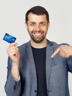 A guy holding his Discover it Balance Transfer.