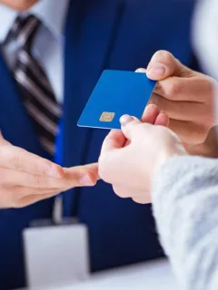 Someone holding a United Explorer credit card.