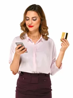 A woman holding her Delta SkyMiles Gold American Express.