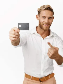 A guy holding a CareCredit card.