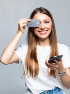 A girl holding her Simmons Visa.