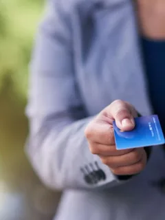 Someone holding a U.S Bank Cash+ Visa Signature.