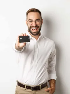 A man holding his Aeroplan Credit Card.