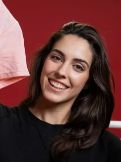 A woman using her Revenued Business Card.