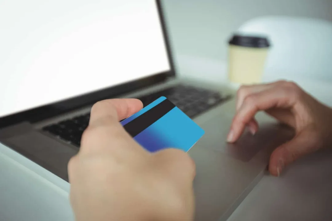 Someone using a Revenued Business card.