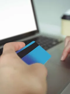Someone using a Revenued Business card.