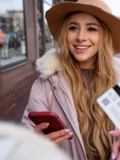 A Woman learning how to use Credit Card Abroad.