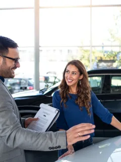 Person checking out car to try to buy with Bank of America Auto Loan.