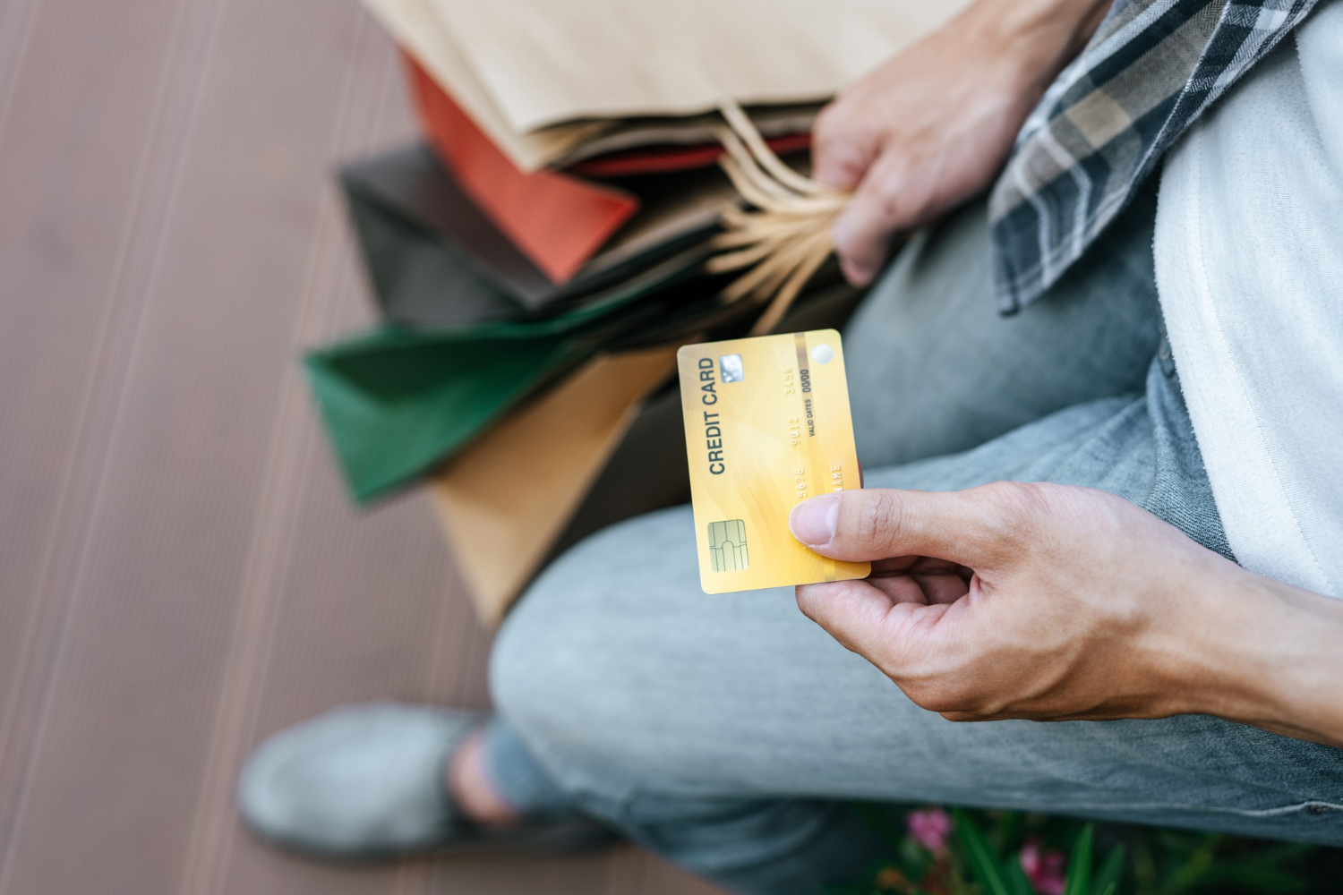 A persona using the Petal 2 Visa card for shopping.