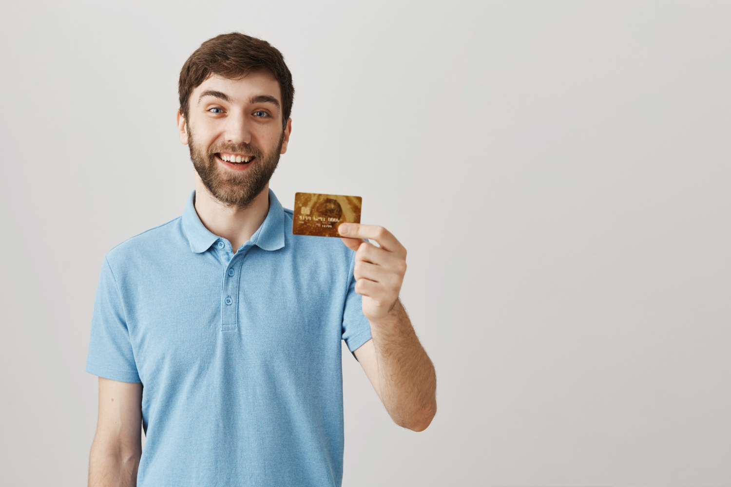 A man holding his Delta SkyMiles Gold American Express.