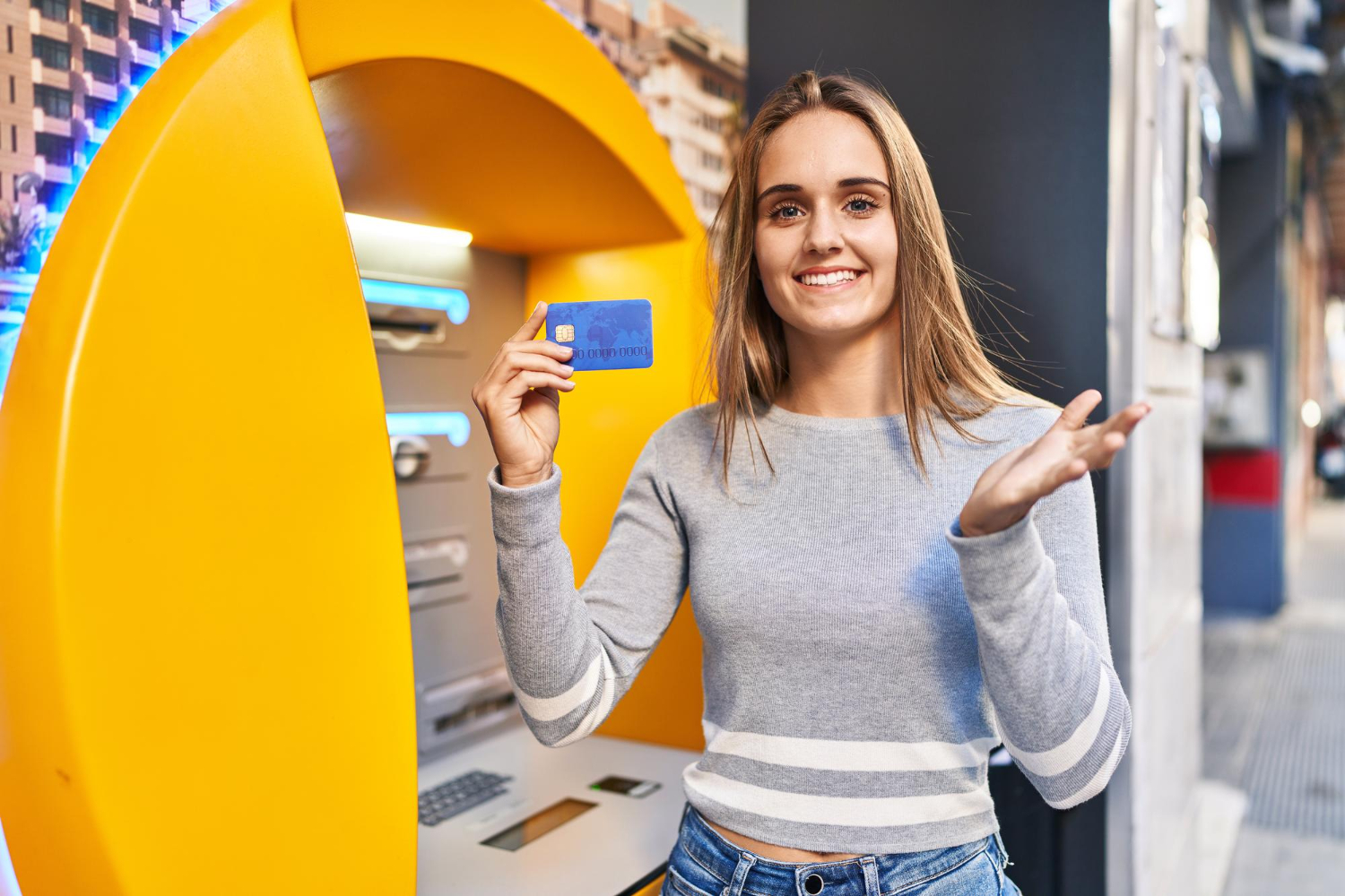 A woman holding her U.S. Bank Cash+ Visa Signature Card.