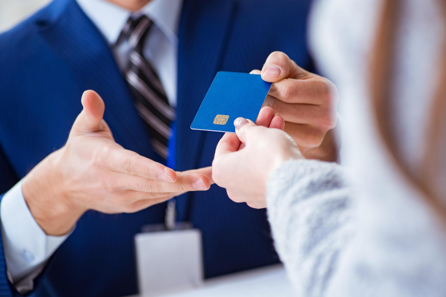 Someone holding a United Explorer credit card.