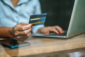 woman checks her bank score through online banking