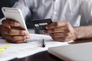 man makes his deposits without leaving the office through online banking