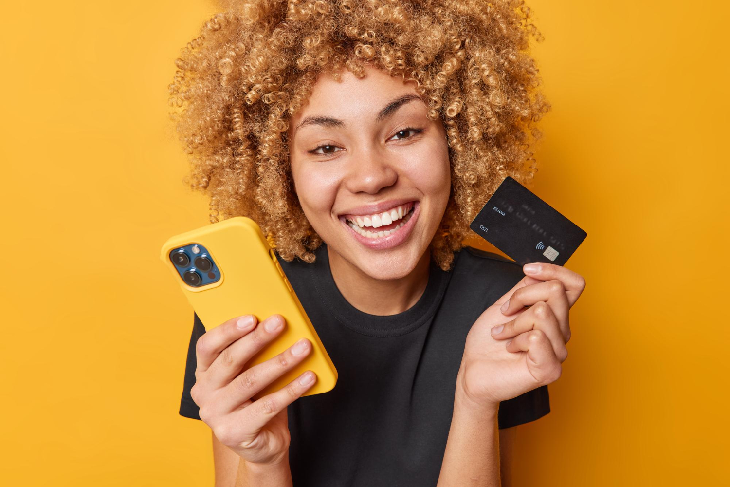 woman happy because she got rewards on her credit card