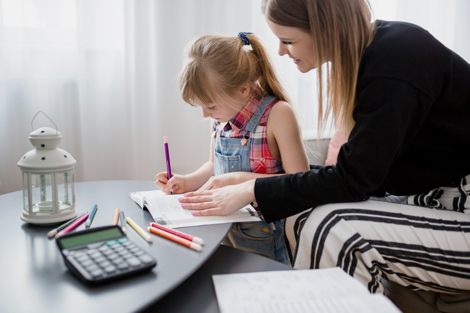 mother teaches financial education to her young daughter