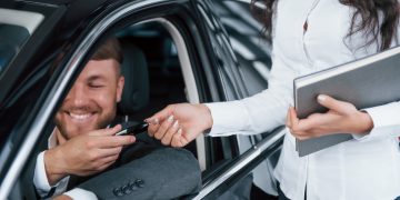 A man buying a car after getting a Auto Loan.