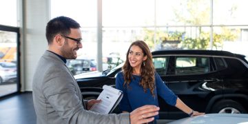 Person checking out car to try to buy with Bank of America Auto Loan.