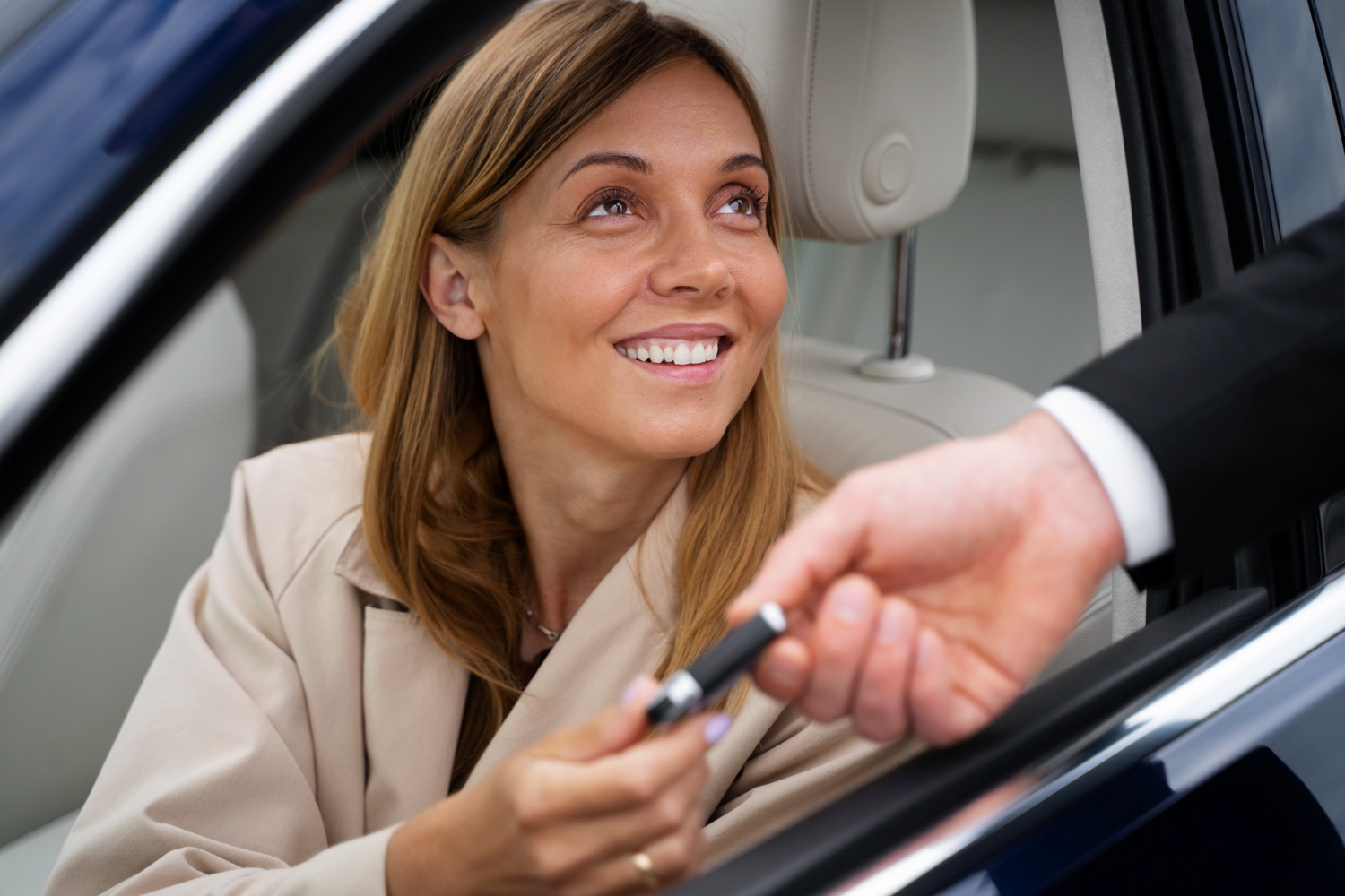 Woman with her car by Indirect auto loans